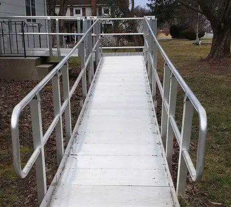 A metal wheelchair ramp on yard